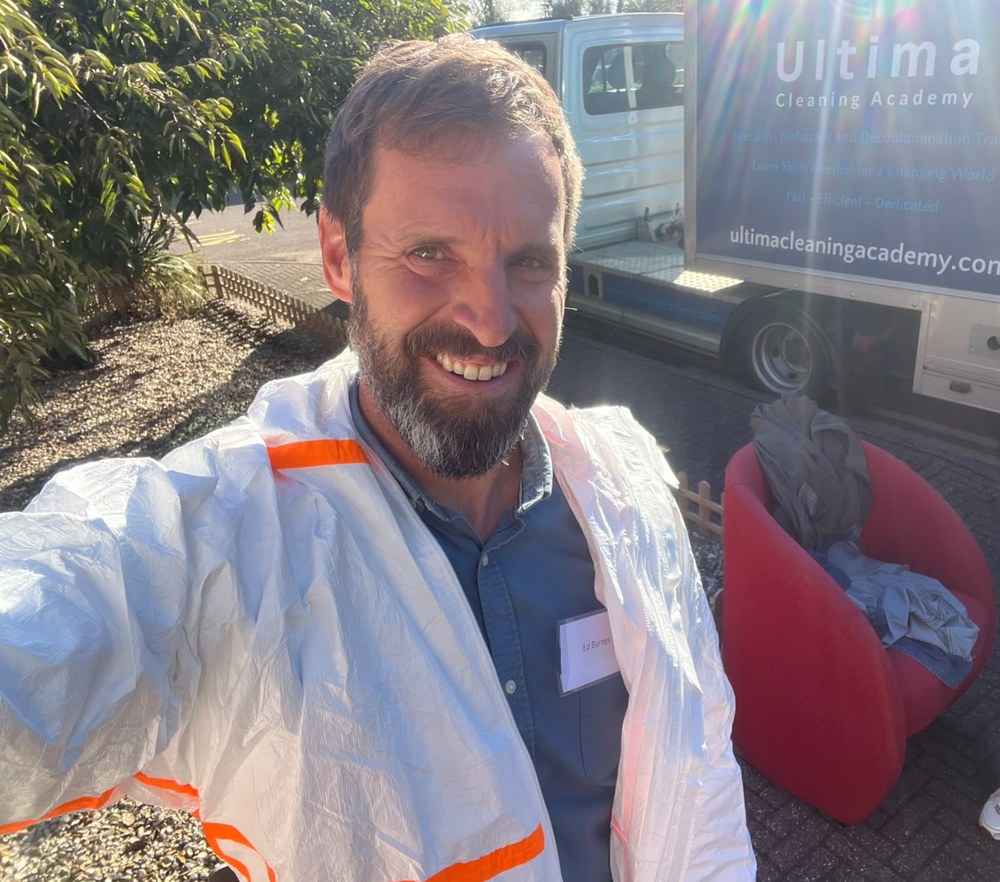 Ed wearing protective clothing during practical biohazard cleaning and decontamination training